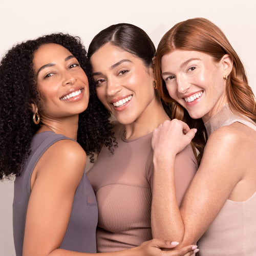 group of three models wearing nude illusion liquid foundation