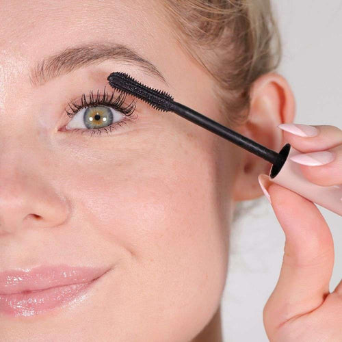 Close up of model applying Wander Beauty Upgraded Lashes™ Treatment Mascara on right eye